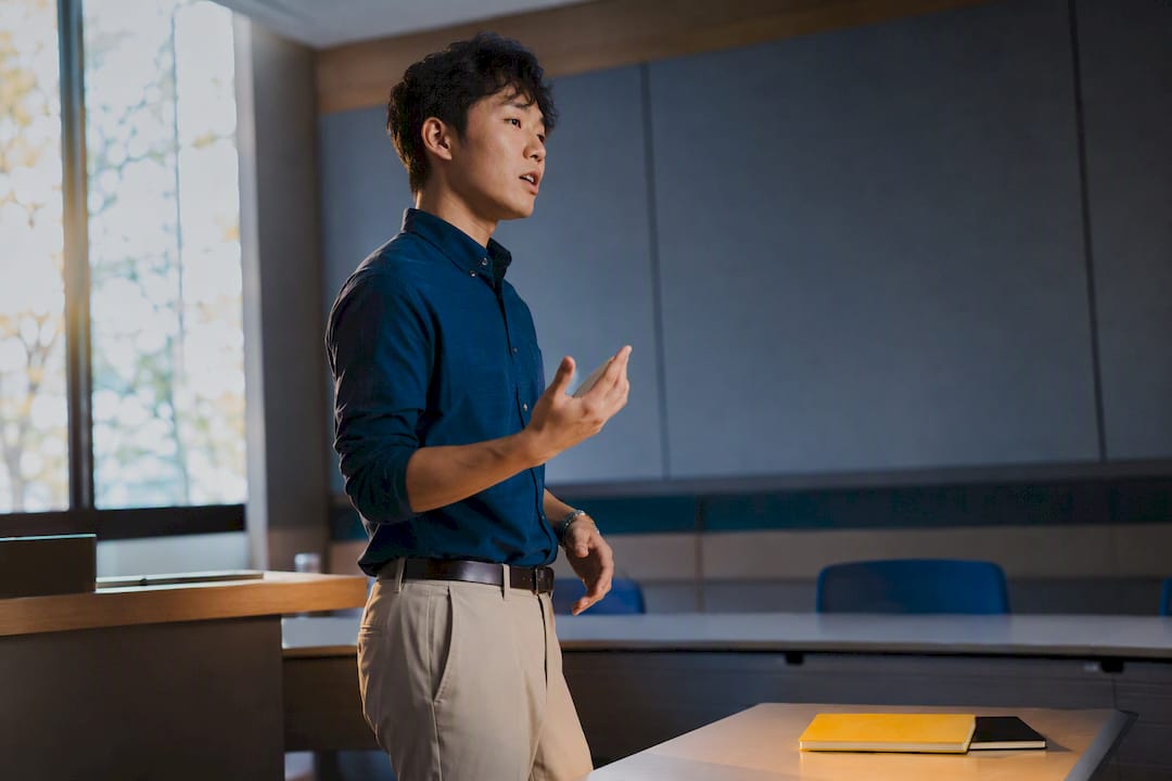 Professional rehearsing a presentation alone