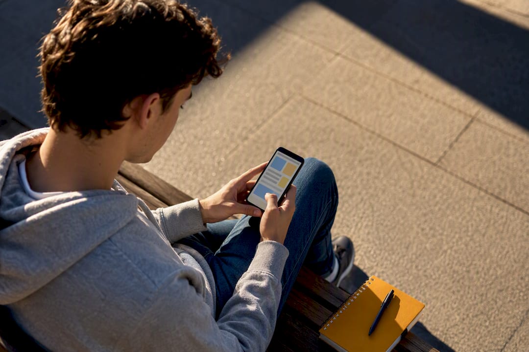 Student reviewing multiple projects on mobile